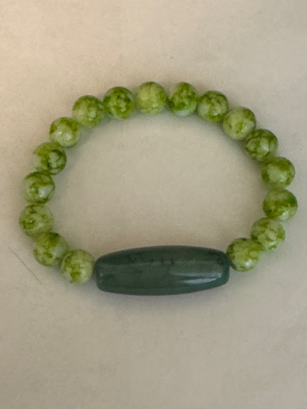 Green Beaded Stretch Bracelet with Teal Accent Bead
